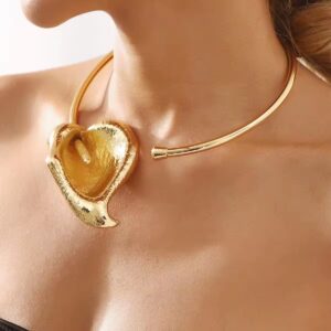 Gold torc choker with leaf pendant.